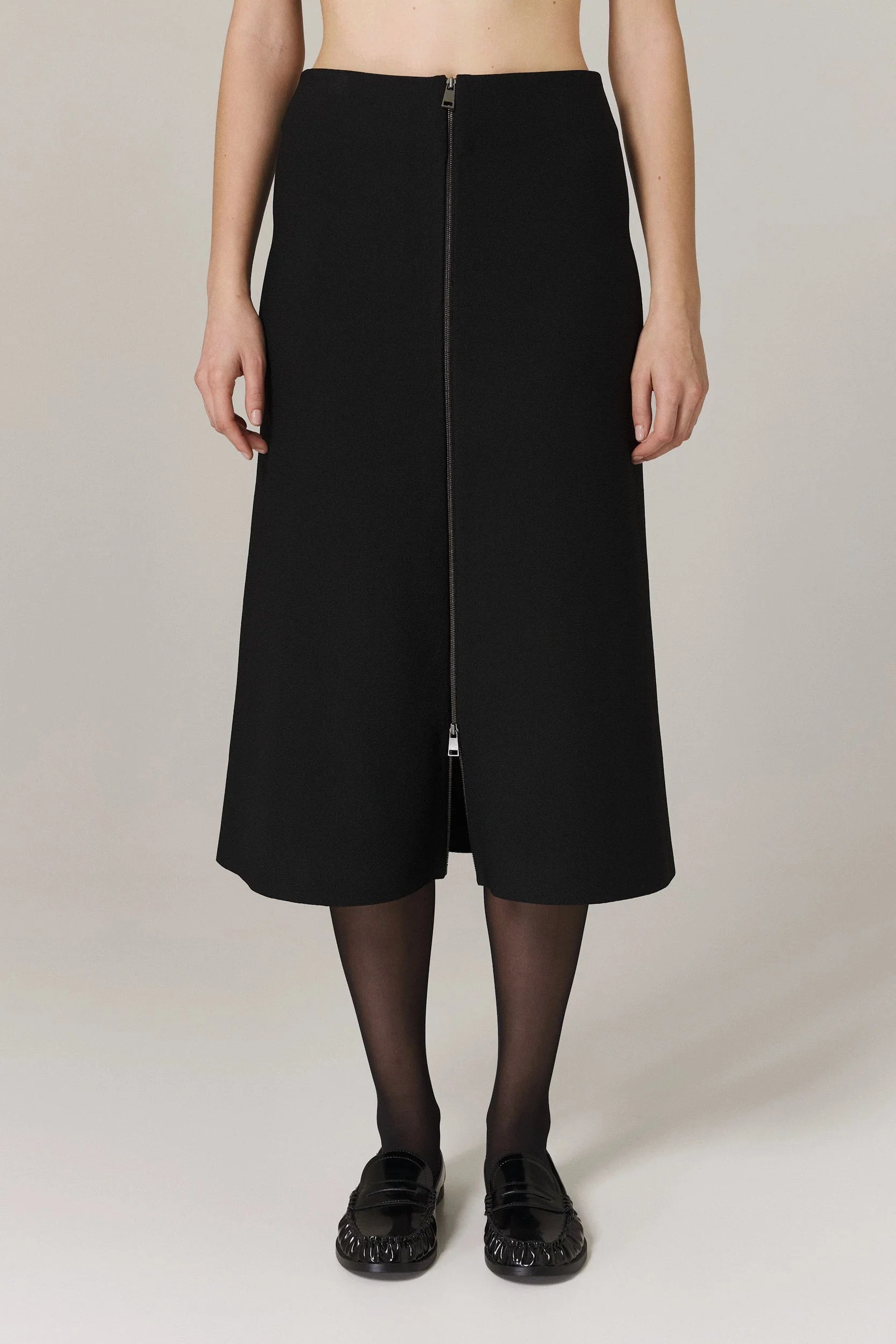 PAULA CIRCULAR KNIT A-LINE SKIRT WITH METAL ZIPPER IN BLACK