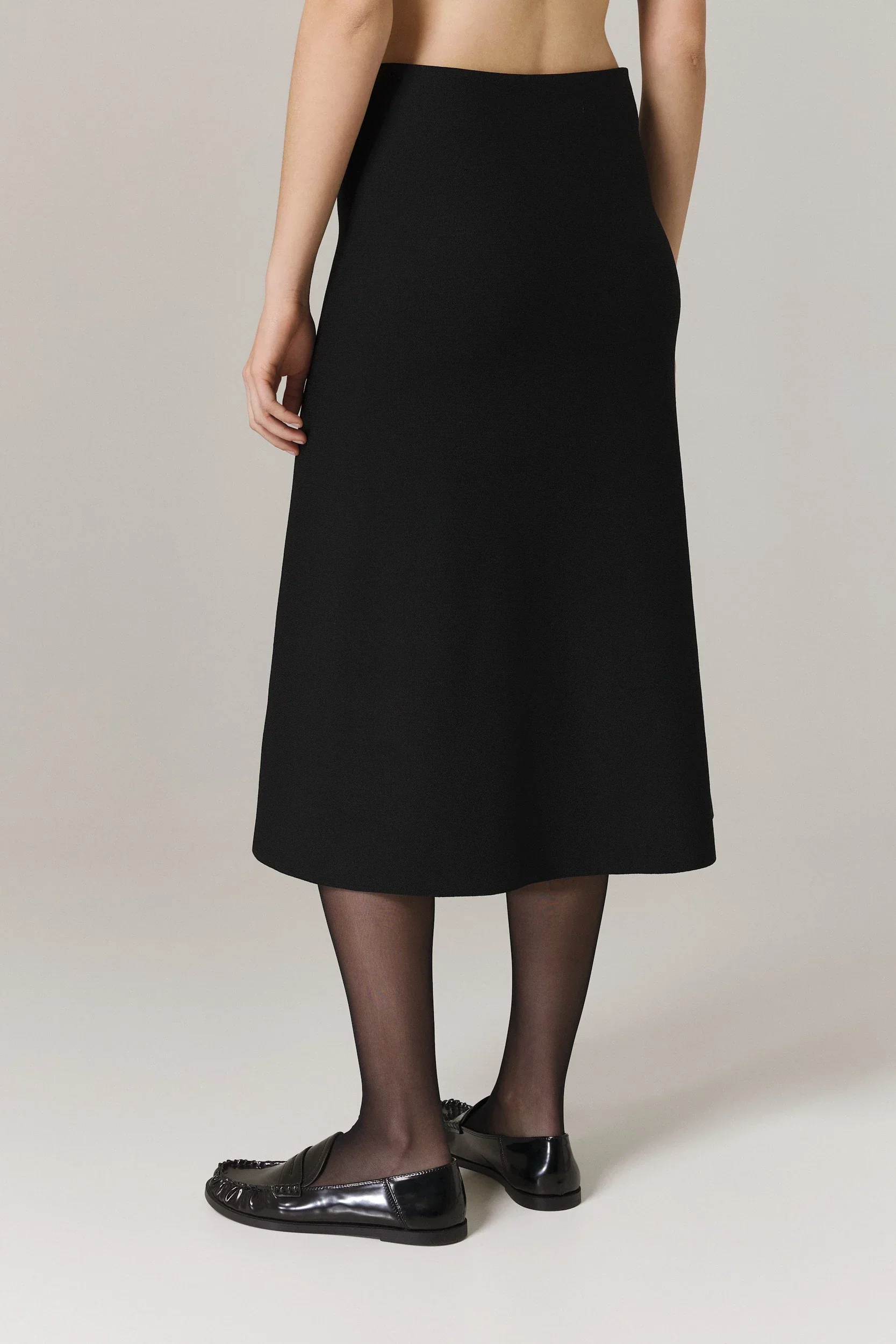 PAULA CIRCULAR KNIT A-LINE SKIRT WITH METAL ZIPPER IN BLACK - Image 4