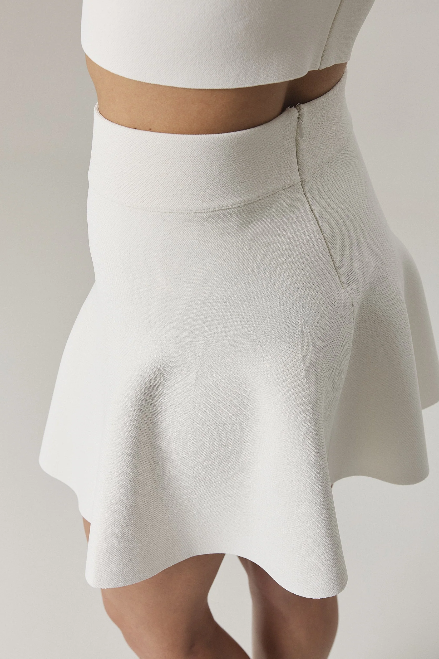 CHELSIE CIRCULAR KNIT MINI SKIRT IN SUGAR - Image 3
