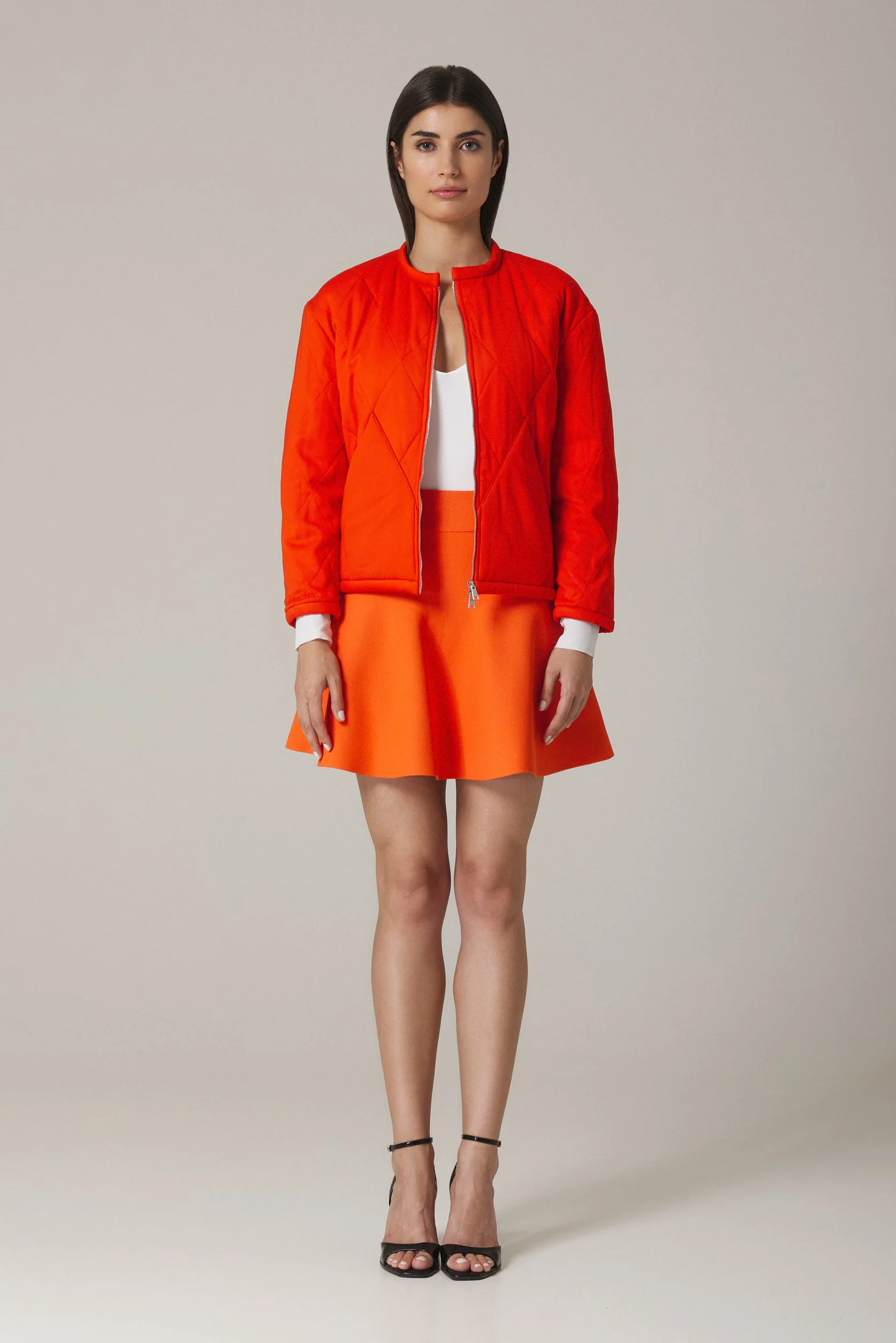 CHELSIE CIRCULAR KNIT MINI SKIRT IN VERMILION